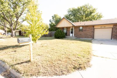 Single story home with a garage and a front yard | Image 3