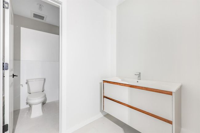 Bathroom featuring tile patterned floors, vanity, and toilet | Image 40