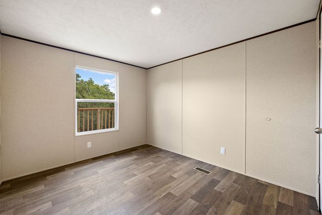 Unfurnished room with visible vents and wood finished floors | Image 31