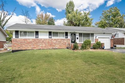 Single story home featuring a front lawn and a garage | Image 3