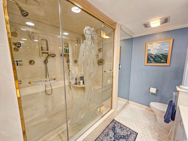 Full bath featuring recessed lighting, ornamental molding, toilet, and a shower stall | Image 26