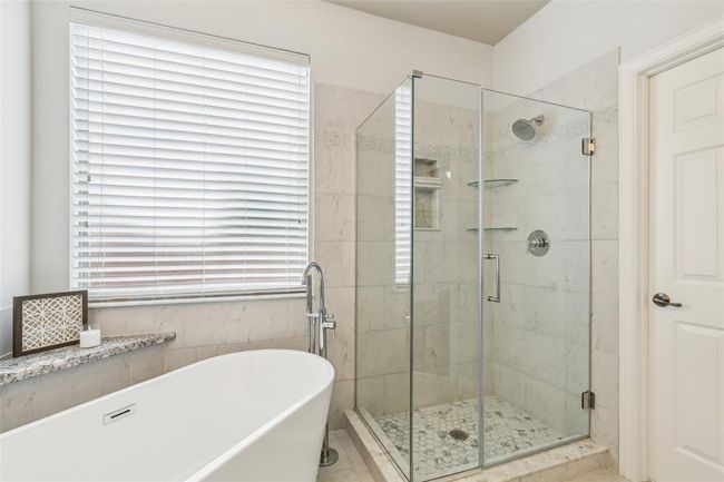 Bathroom with tile floors and plus walk in shower | Image 18