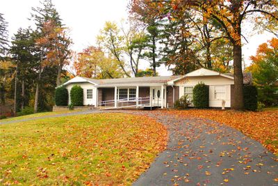 Ranch-style home featuring a front lawn and a porch | Image 2