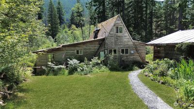 A-framed home, garage on right | Image 1