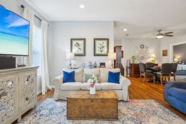 Living area featuring recessed lighting, wood plank laminate flooring, and ceiling fan | Image 9