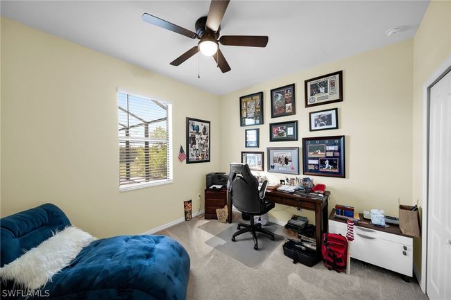 Carpeted office space with ceiling fan | Image 23
