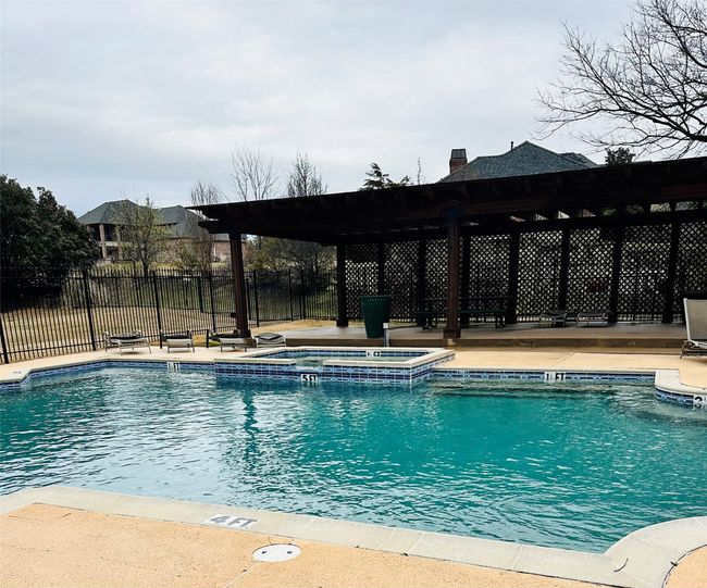 Community Pool featuring fence and a hot tub | Image 27