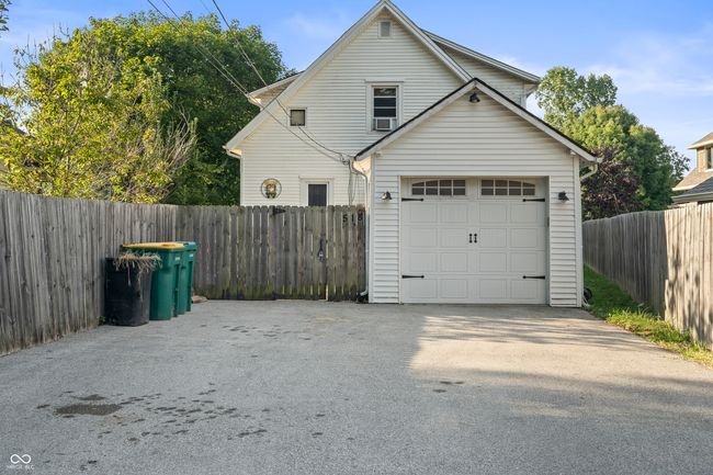 garage featuring driveway | Image 57