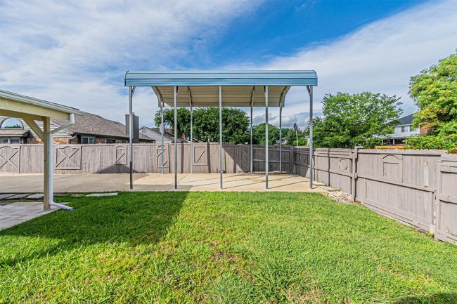Fenced backyard featuring a patio | Image 36