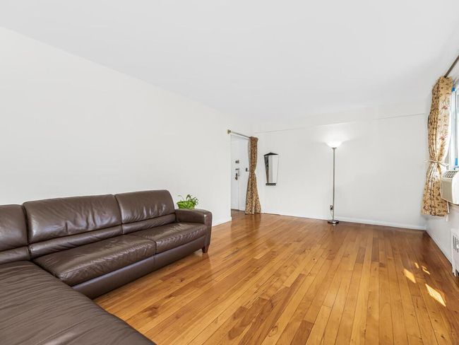 Living room with hardwood / wood-style floors | Image 5