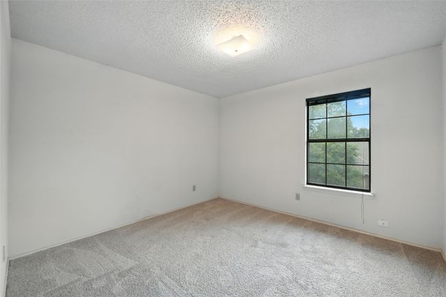 Carpeted spare room featuring a textured ceiling | Image 27