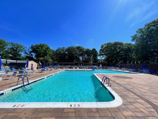 Community pool with a patio area | Image 19
