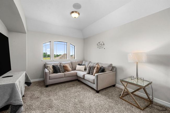 Conveniently located and well-lit spacious extended lounge/gaming area with wonderful window view | Image 26