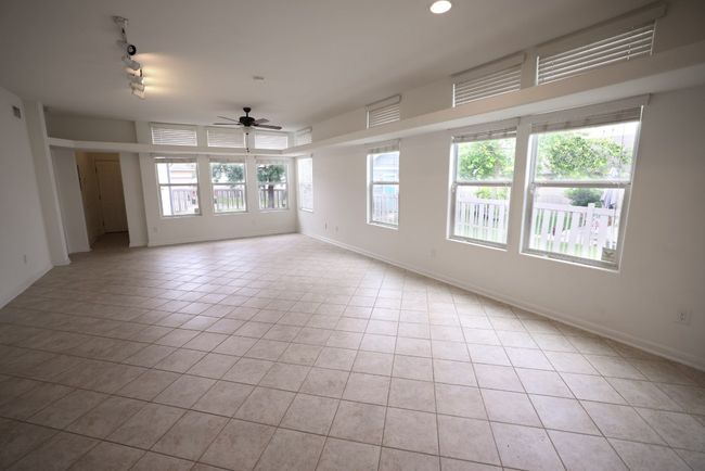 Gorgeous open concept living room with an abundance of space to configure your ideal living and dining areas. | Image 8