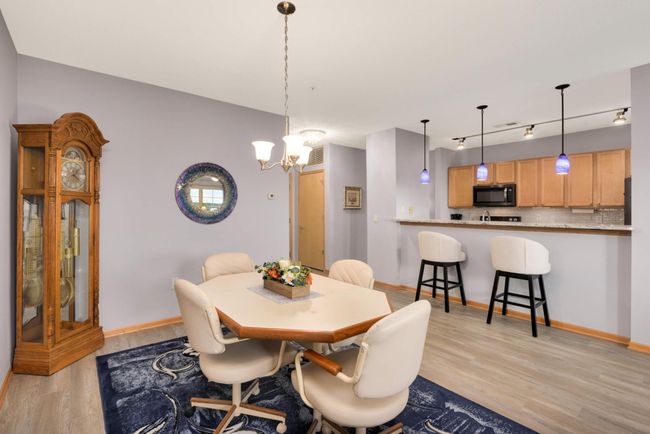 The view from the dining area to the kitchen and entryway. | Image 6