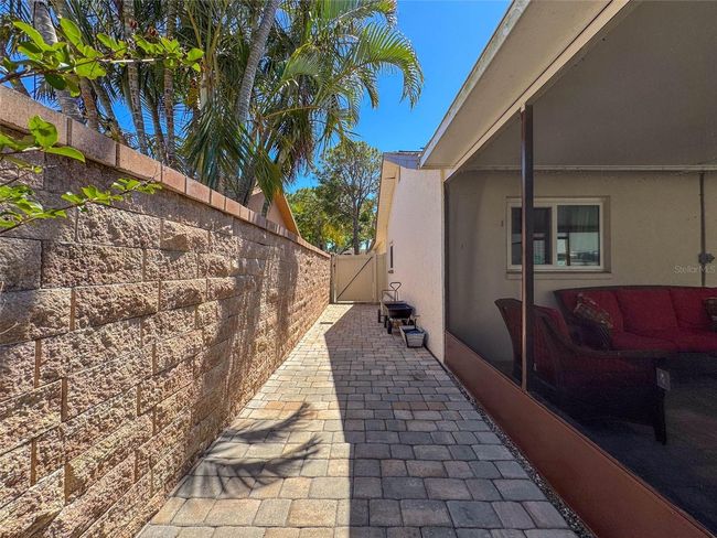 side entrance with locking gates . Locks are higher to comply with safety standards for pool access. | Image 50