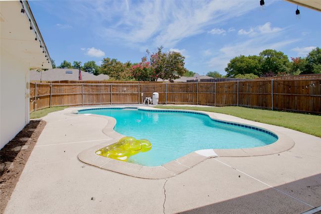 View of pool with a patio area and a fenced backyard | Image 31