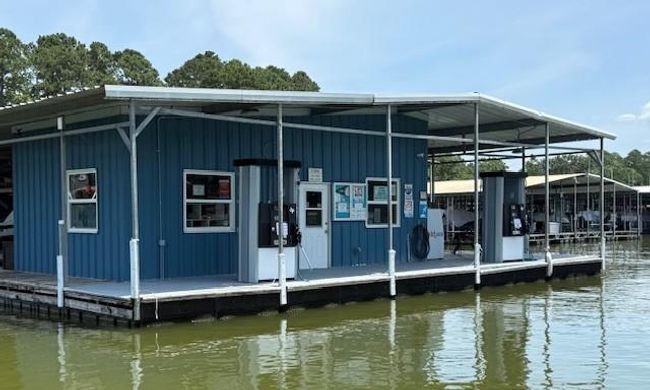 Enjoy the community marina with deep water access, featuring a convenient store, gas pumps, and rentable boat slips. | Image 45