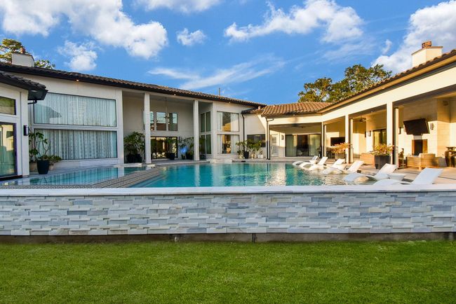 This photo highlights the views of the backyard from almost every room in the home! | Image 47