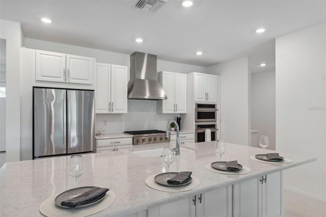 33466 Landsman Loop, House other with 4 bedrooms, 5 bathrooms and null parking in Wesley Chapel FL | Image 4