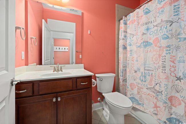 Full bath featuring toilet, vanity, visible vents, and tile patterned floors | Image 27