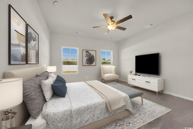 Carpeted bedroom with visible vents, baseboards, and a ceiling fan | Image 4