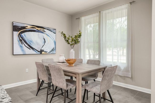 Dining area featuring baseboards and tile patterned floors | Image 11