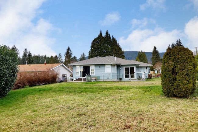 Rear view of house with a lawn | Image 27