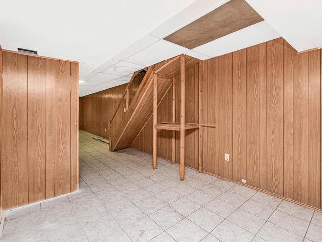 Finished basement featuring wood walls | Image 20
