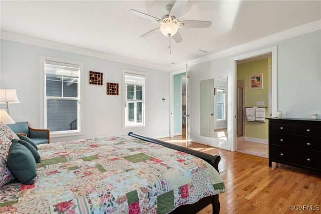 Generously sized primary bedroom with en-suite and large walk-in closet. Custom blinds found throughout this room. | Image 15