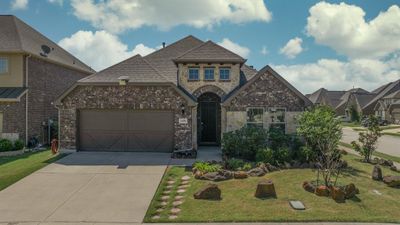 View of front of house featuring a garage and a front lawn | Image 2