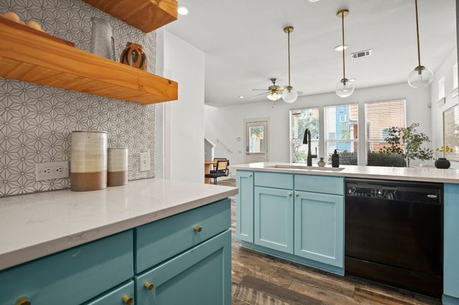 Kitchen with dishwasher, a sink, recessed lighting, dark wood-type flooring, and a ceiling fan | Image 5