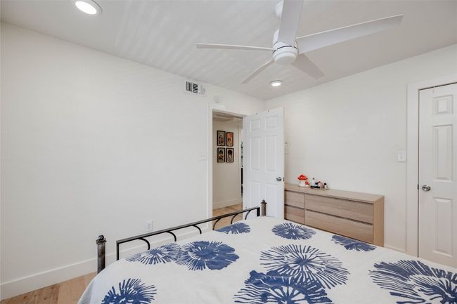 Bedroom featuring recessed lighting, wood finished floors, and a ceiling fan | Image 15