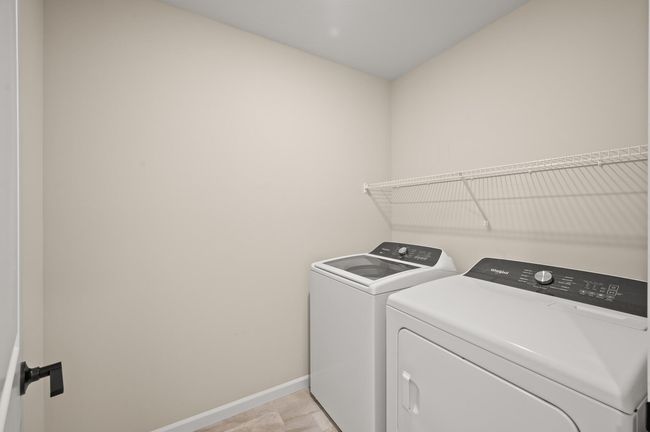 Upper level laundry room with whirlpool washer and dryer | Image 25
