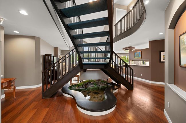 Stairs featuring recessed lighting, wood finished floors, and baseboards | Image 16