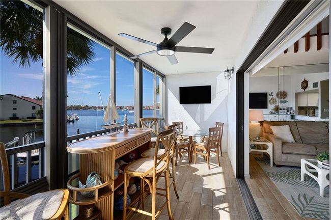 Florida room featuring ceiling fan and a healthy amount of sunlight | Image 10