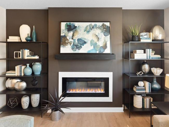 The elegant and sleek electric fireplace is just one of the many stunning features in the family room, adding both warmth and style to this inviting space. | Image 8