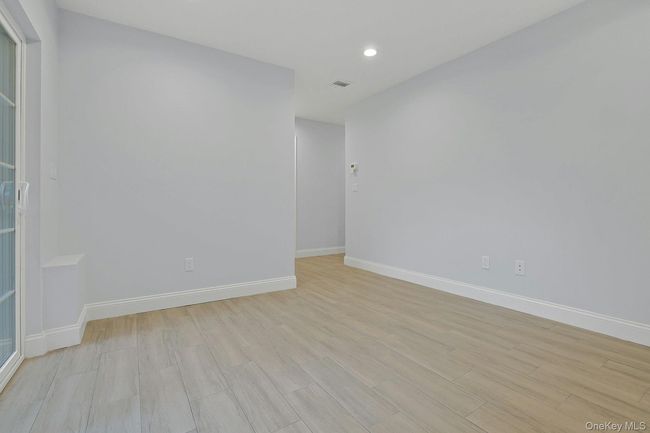 Family room with tiled floors and recessed lighting | Image 21