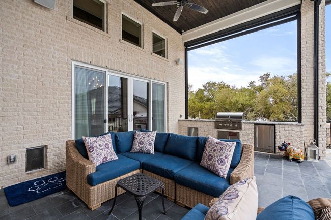 View of patio / terrace with ceiling fan, grilling area, exterior kitchen, and an outdoor living space | Image 35
