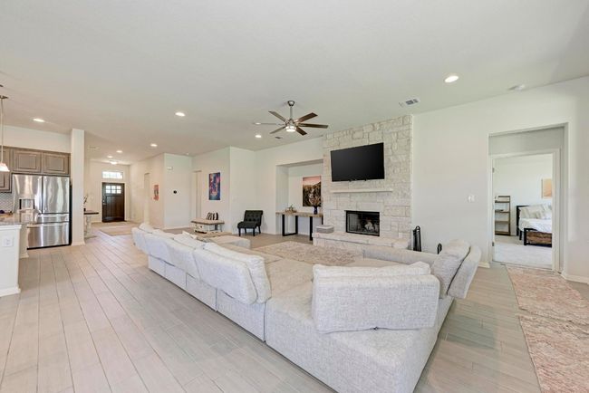This spacious Great Room features multiple searing area possibilities, ideal for gatherings and relaxation. Please note that there is a floor plug under the sectional couch. | Image 7