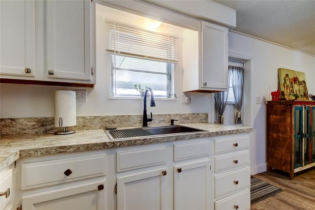 23. FULLY UPDATED Kitchen (9.2' x 8.9') w Kitchen Sink Window! Stainless Appliances, White Cabinets, Plenty of Storage, Gorgeous Counters!. | Image 23
