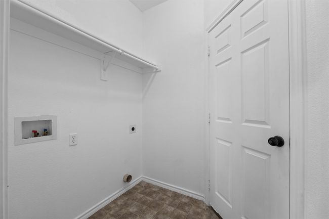 Washroom featuring hookup for an electric dryer, laundry area, baseboards, and washer hookup | Image 5