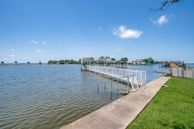 Dock featuring a water view and boat lift | Image 25
