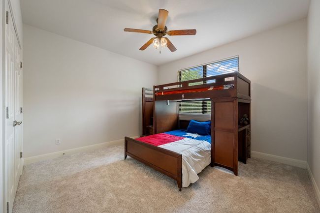 Carpeted bedroom featuring baseboards and a ceiling fan | Image 29