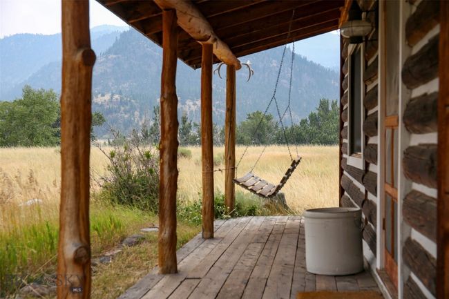 Front porch and hanging swing - front porch of Yellowstone Cabin | Image 15
