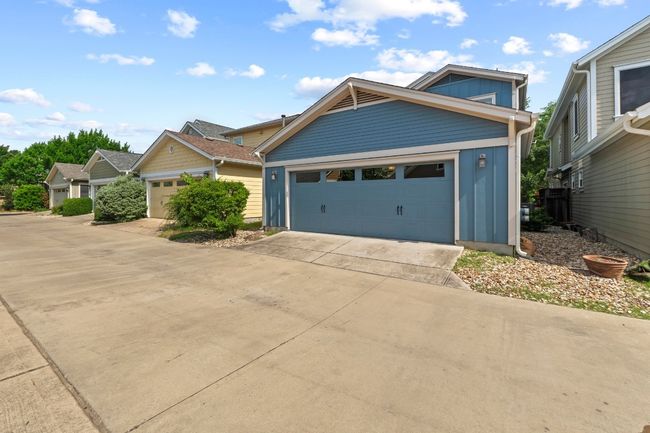 Alley access to a large two-car garage. | Image 36