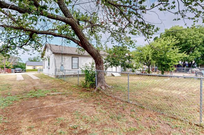 View of yard leads to driveway | Image 14
