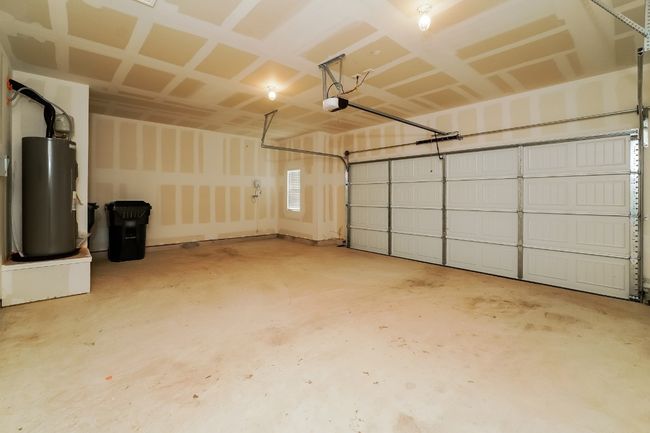Garage with water heater and a garage door opener | Image 21
