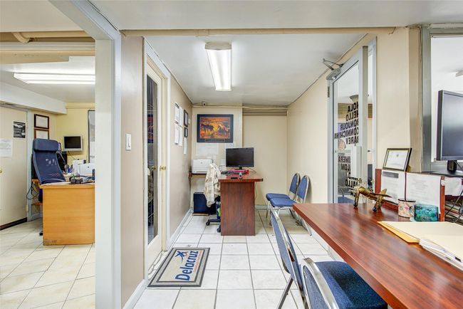 Office area featuring light tile patterned floors | Image 6