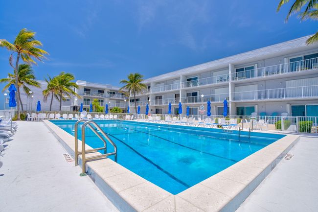 View of pool back to building | Image 23